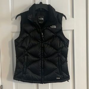 Women’s The North Face black puffer vest size small.